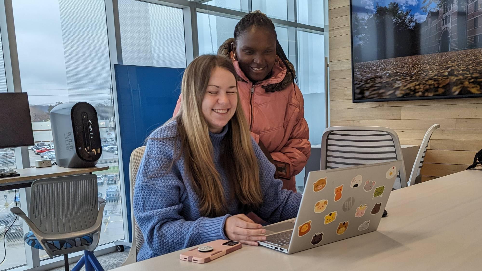 Students working on a laptop